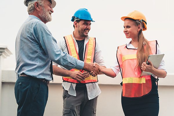 Project Management Team Of Engineers And Architects Are Handshake Together After Dealing Their Project, Business Construction Concepts