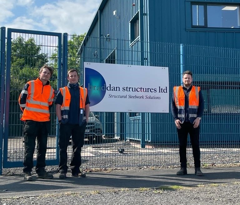 Image shows three staff members from Braddan Structures outside their premises in Darlington