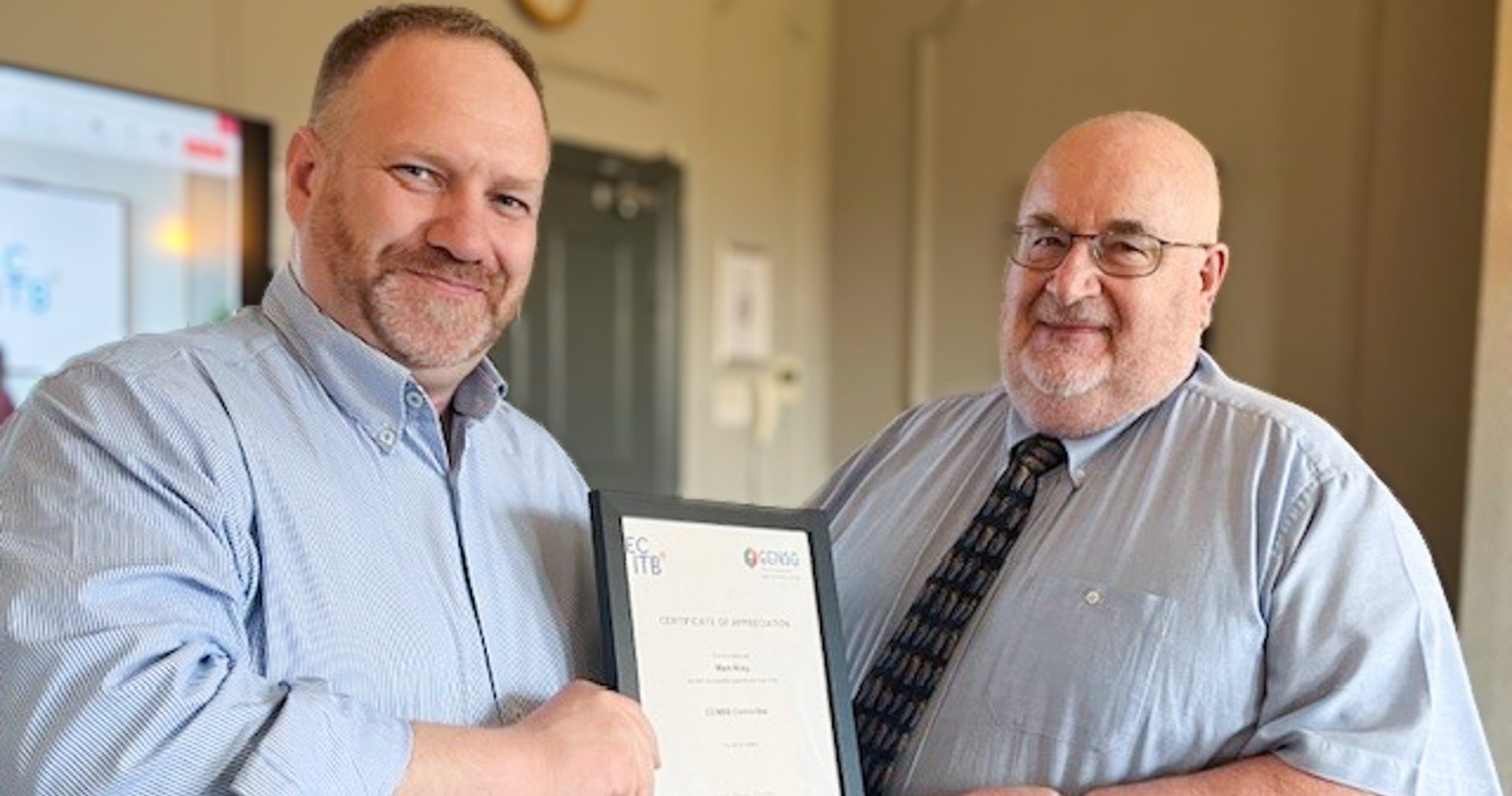 Dave Boden Hook Right Presents Mark Riley With A Certificate Of Appreciation At His Last CCNSG Committee Meeting Aspect Ratio 760 400