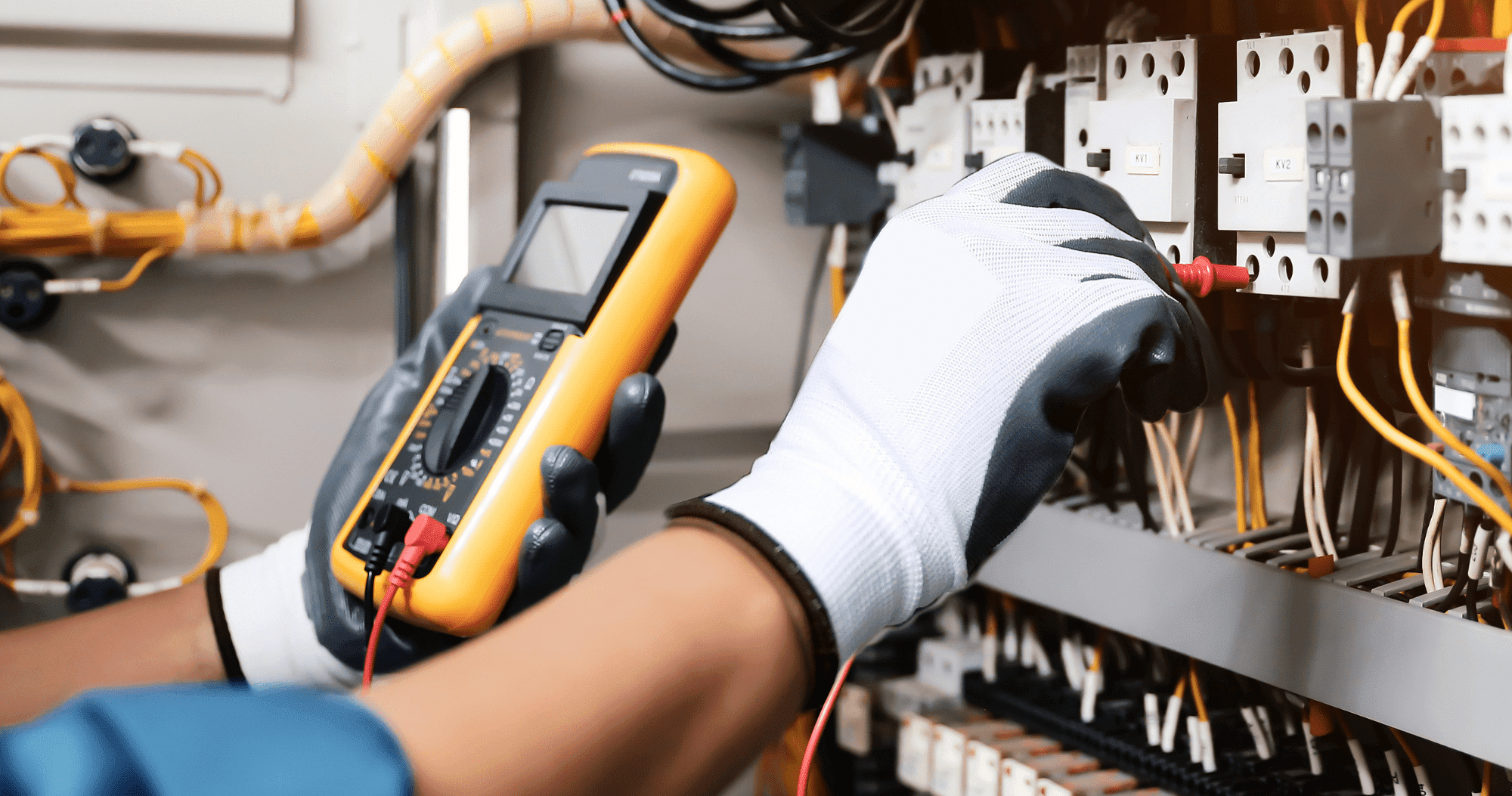 Electrical Person Wearing Safety Gloves Testing Wires Aspect Ratio 760 400