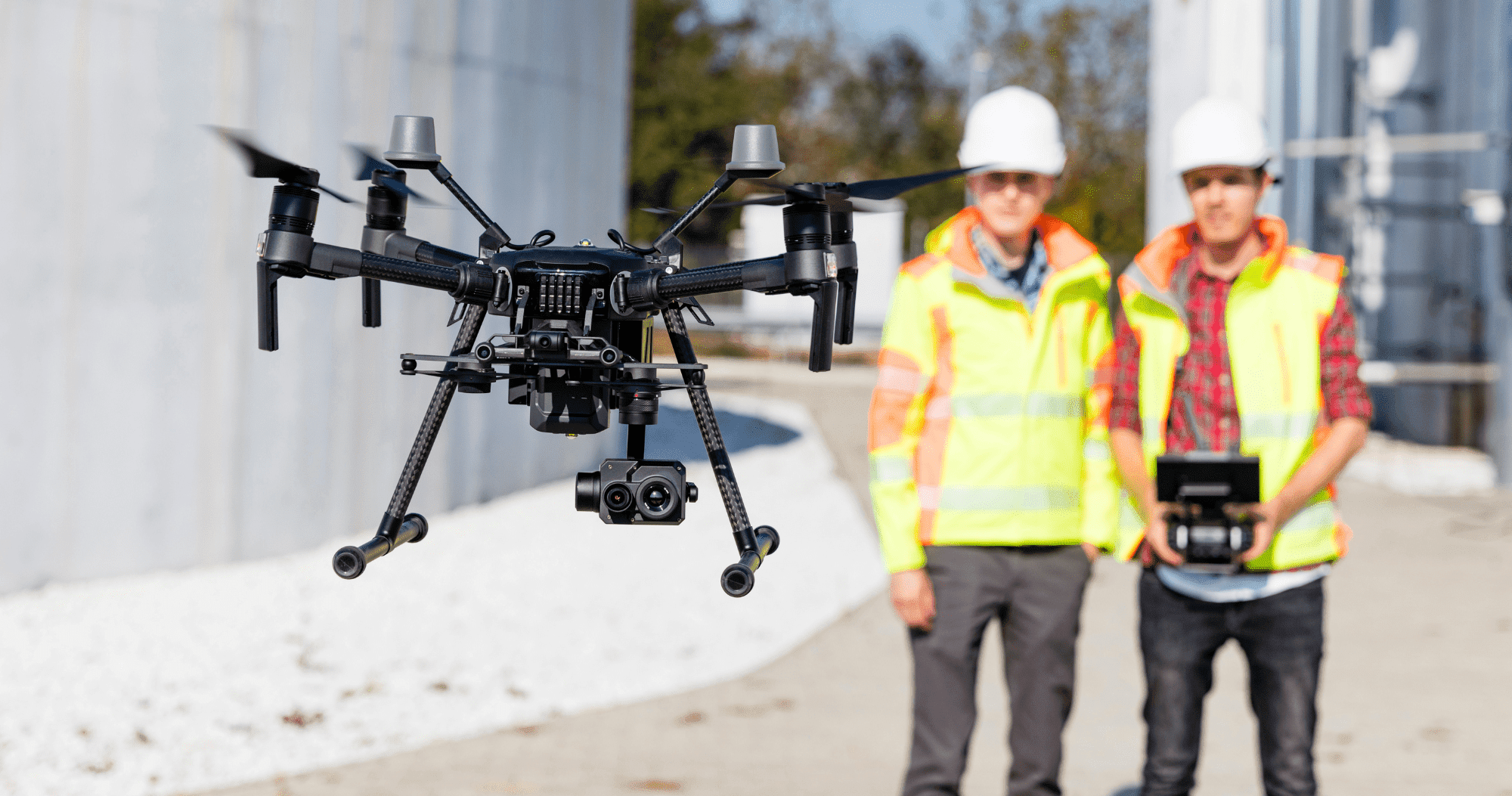 Industrial Drone  Two People Flying A Drone Around An Industrial Site Aspect Ratio 760 400