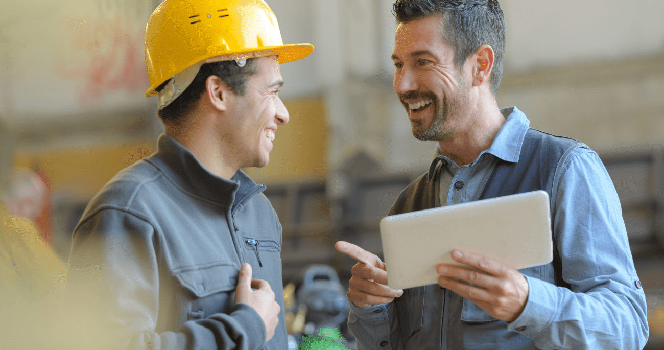Man In Hard Hat And Man With Tablet Smiling  Aspect Ratio 760 400