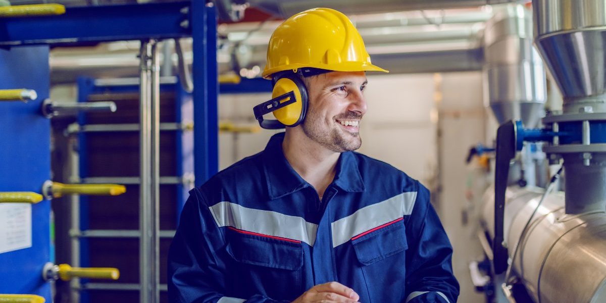 Man Wearing A Hard Hat And Holding A Tablet In A Factory Aspect Ratio 1160 580