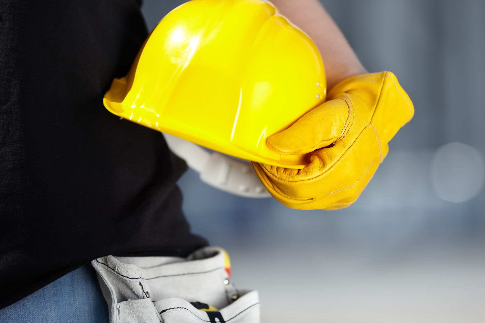 Person Holding Yellow Hard Hat Aspect Ratio 1200 800