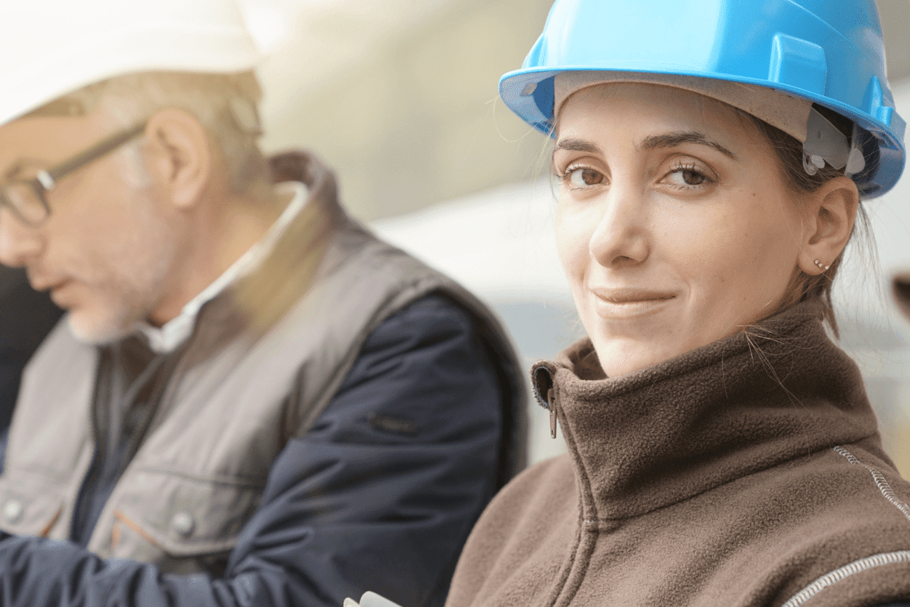 Woman Assessor In Hard Hat With A Man In A Hard Hat Aspect Ratio 1200 800