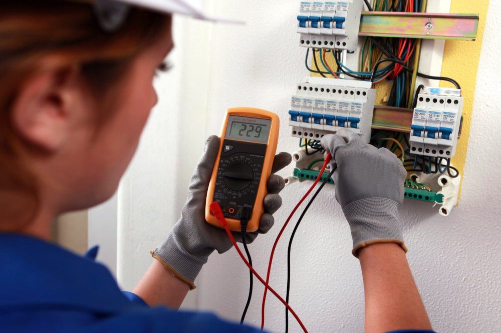 Woman Undertaking Electrical Testing Aspect Ratio 1200 800